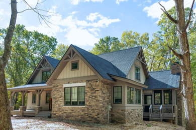 Small rustic beige two-story concrete fiberboard exterior home idea in Detroit with a shingle roof