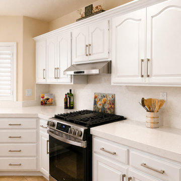 White Quartz Kitchen with Navy Island and Plantation Shutters
