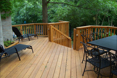 Small transitional backyard patio photo in Toronto with a pergola