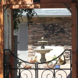 Arbor with Wrought Iron Gate - Home Fencing And Gates