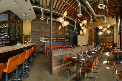Dining room - industrial dining room idea in Portland