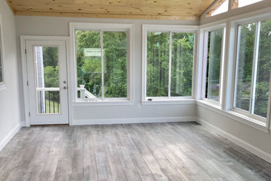 Example of a sunroom design in Other