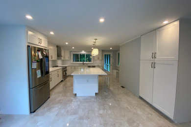Kitchen - modern kitchen idea in DC Metro with an island