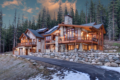 Rustic brown two-story mixed siding exterior home idea in Denver with a shingle roof