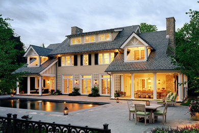 Elegant beige three-story stucco exterior home photo in New York