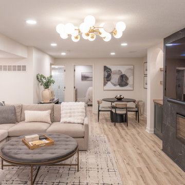 Warm & Inviting Basement Retreat with Custom Bar + Entertainment Center