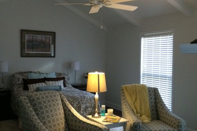 Example of a mid-sized classic master dark wood floor bedroom design in Other with gray walls, a standard fireplace and a tile fireplace