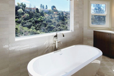 Example of a large transitional master white tile ceramic tile, white floor and double-sink bathroom design in Los Angeles with shaker cabinets, medium tone wood cabinets, an undermount sink, quartz countertops, a hinged shower door, white countertops and a built-in vanity
