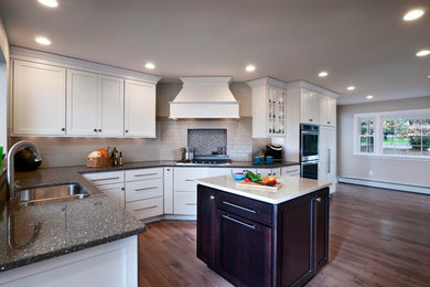 Eat-in kitchen - huge transitional l-shaped medium tone wood floor eat-in kitchen idea in Philadelphia with an undermount sink, recessed-panel cabinets, white cabinets, quartz countertops, gray backsplash, subway tile backsplash, stainless steel appliances and an island
