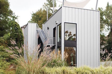 Mid-sized trendy gray two-story metal exterior home photo in Chicago with a metal roof