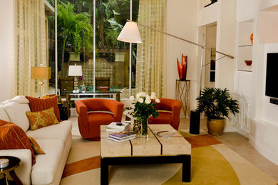 Mid-sized transitional open concept living room photo in Miami with beige walls and a wall-mounted tv