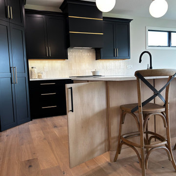 Black and Maple Wheat Kitchen with Brass Banded Hood