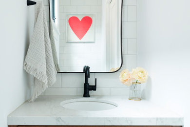 Example of a trendy powder room design in Toronto