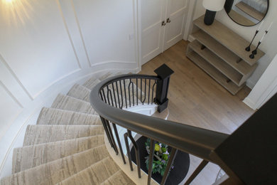 Staircase - huge contemporary curved mixed material railing staircase idea in Chicago