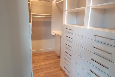 Example of a trendy closet design in Seattle