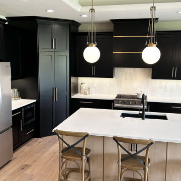 Black and Maple Wheat Kitchen with Brass Banded Hood