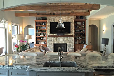 Mid-sized mountain style galley medium tone wood floor eat-in kitchen photo in Little Rock with an undermount sink, granite countertops, white backsplash, subway tile backsplash, stainless steel appliances, an island, recessed-panel cabinets and blue cabinets