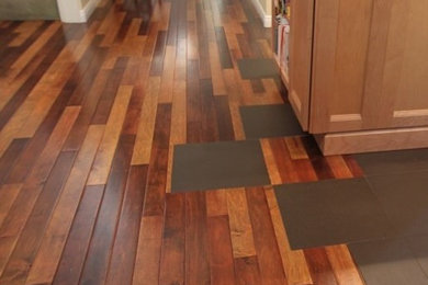 Eclectic medium tone wood floor family room photo in Orange County