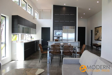 Inspiration for a huge modern l-shaped porcelain tile and gray floor open concept kitchen remodel in Hawaii with a single-bowl sink, flat-panel cabinets, gray cabinets, quartz countertops, stainless steel appliances and an island