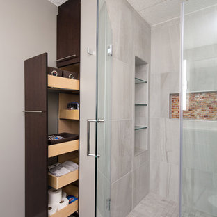 Mid-sized trendy master gray tile and stone tile ceramic floor walk-in shower photo in Chicago with flat-panel cabinets, dark wood cabinets, a one-piece toilet, gray walls, a drop-in sink and quartzite countertops