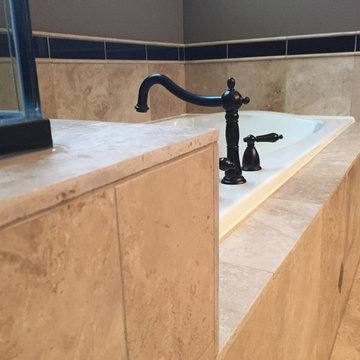 Custom Travertine Bathroom with Black Galaxy Accents