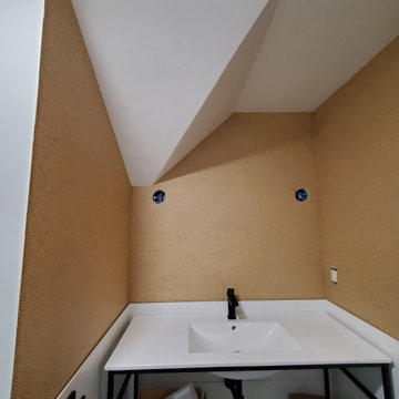 Wallpapering in a bathroom with grasscloth material