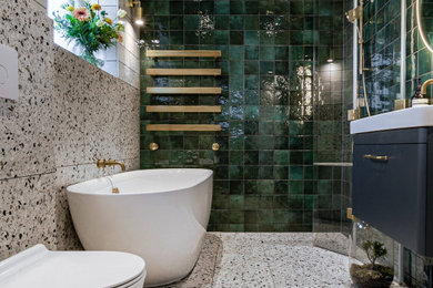 Design ideas for a medium sized eclectic bathroom in Surrey with blue cabinets, green tiles, marble tiles, multi-coloured walls, a console sink, a hinged door, white worktops, a feature wall, a single sink and a floating vanity unit.