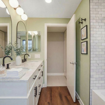 Irvine Master Bathroom Remodel Featuring Vanity with Lighting Fixture