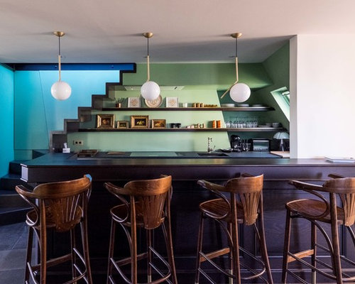 Idées déco pour une cuisine américaine éclectique en U de taille moyenne avec une péninsule.