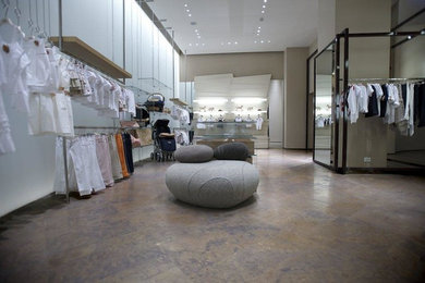 Inspiration for a large modern enclosed marble floor and brown floor family room remodel in Milan with white walls