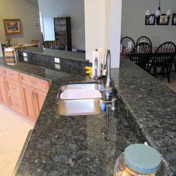 Galaxy Pecan cabinets with peacock green granite