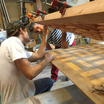 Studio assistant checks the glue-up