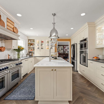 Warm Traditional Kitchen Remodel with Cream Cabinets & Herringbone Floors