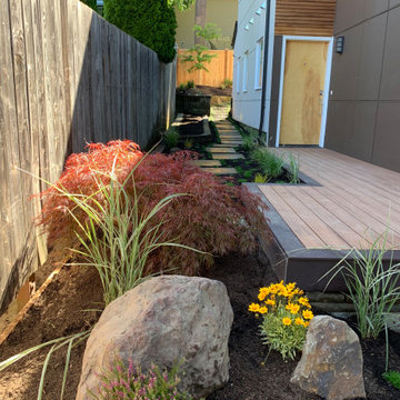 Deck platform, fence, hardscape, garden and planters.