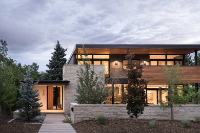 Example of a mid-sized trendy two-story wood house exterior design in Denver