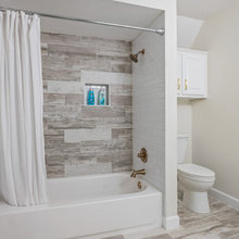 Wood look tile alcove tub and niche