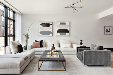Midcentury formal open concept living room in New York with white walls, carpet and grey floor.