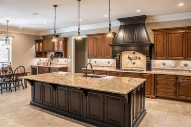 Inspiration for a timeless l-shaped eat-in kitchen remodel in New Orleans with an island