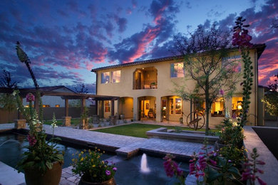 Tuscan home design photo in Phoenix