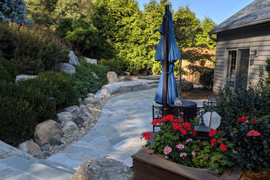 Design ideas for an asian backyard garden in Philadelphia with natural stone pavers.