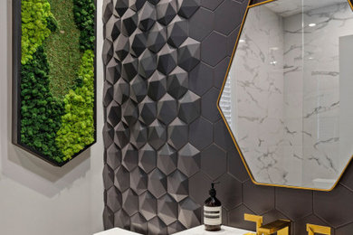 This is an example of a mid-sized modern powder room in Chicago with recessed-panel cabinets, dark wood cabinets, a one-piece toilet, gray tile, stone tile, white walls, an integrated sink, engineered quartz benchtops, white benchtops and a built-in vanity.