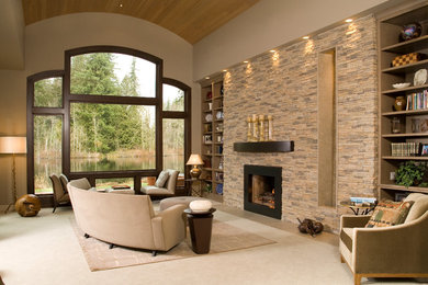 Living room - large transitional open concept carpeted living room idea in Seattle with a stone fireplace, beige walls and a standard fireplace