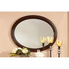 Bowery Hill Traditional Wood Frame Oval Mirror in Brown Cherry