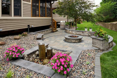 Example of a classic concrete paver patio design in Minneapolis