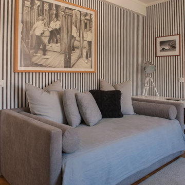 Striped Wallcovering and Upholstered Bed in Bedroom