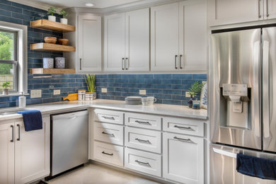 Example of a mid-sized farmhouse u-shaped ceramic tile and beige floor enclosed kitchen design in Dallas with an undermount sink, shaker cabinets, gray cabinets, quartz countertops, blue backsplash, mosaic tile backsplash, stainless steel appliances, no island and white countertops