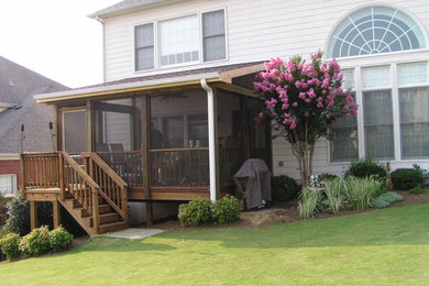 Mid-sized mountain style screened-in back porch photo in Atlanta with decking and a roof extension