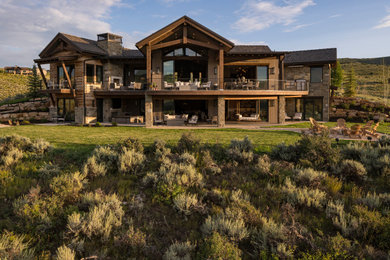 Rustic brown two-story exterior home idea in Salt Lake City with a shingle roof and a gray roof