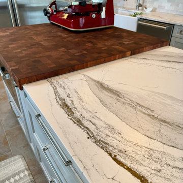Thick sapele mahogany wood top overlapping the quartz counter
