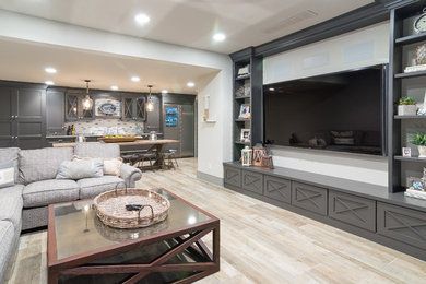 Inspiration for a huge cottage open concept laminate floor and beige floor home theater remodel in Philadelphia with beige walls and a wall-mounted tv